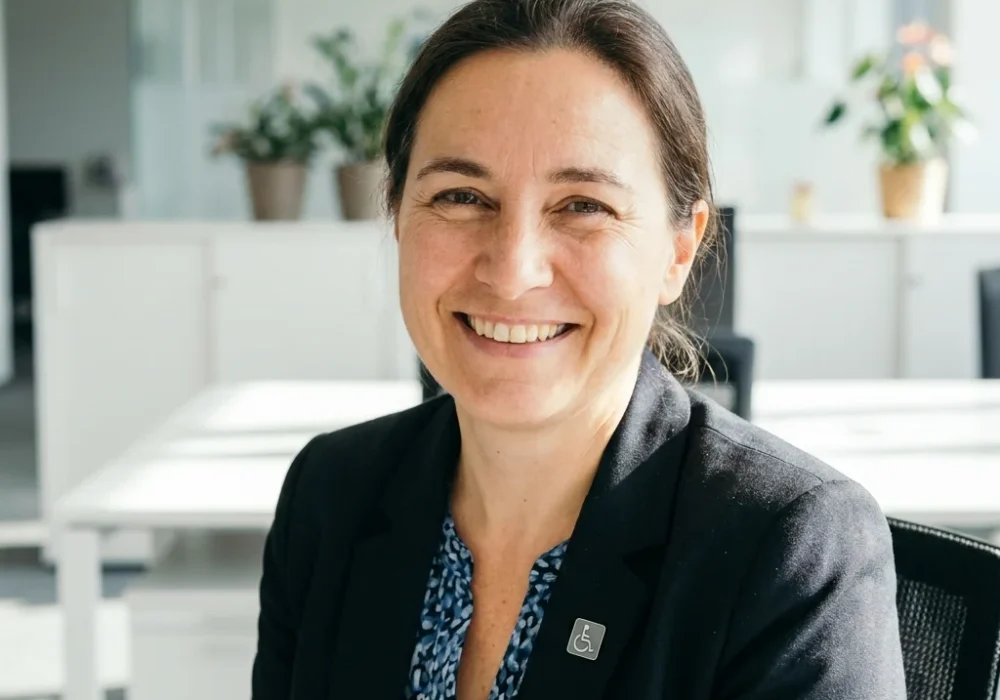Disability advocate smiling in o… 202607090239